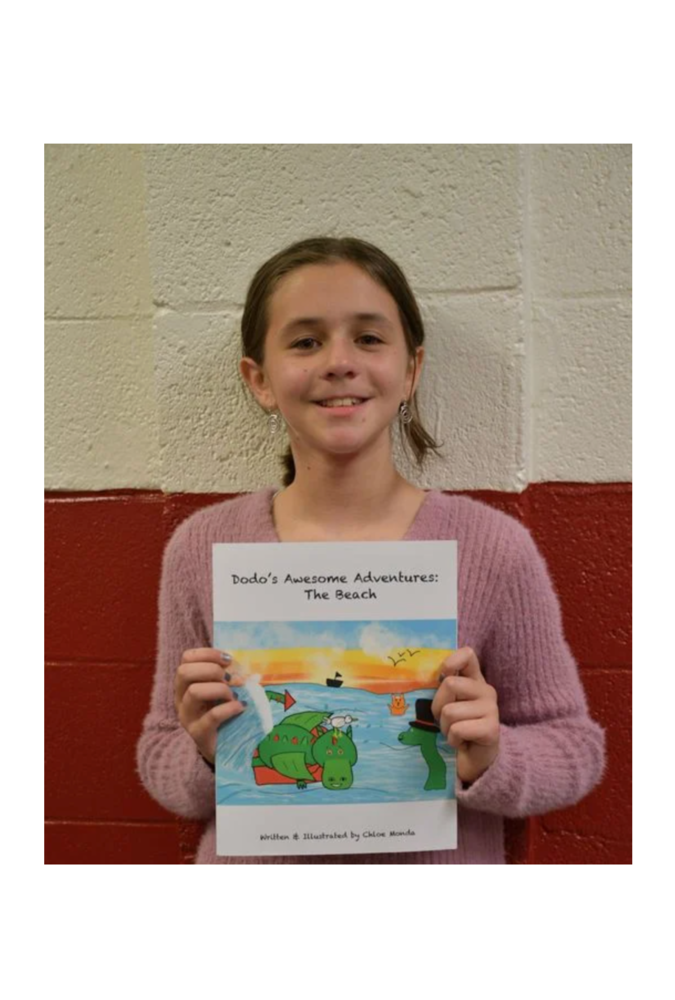 student author holding her book